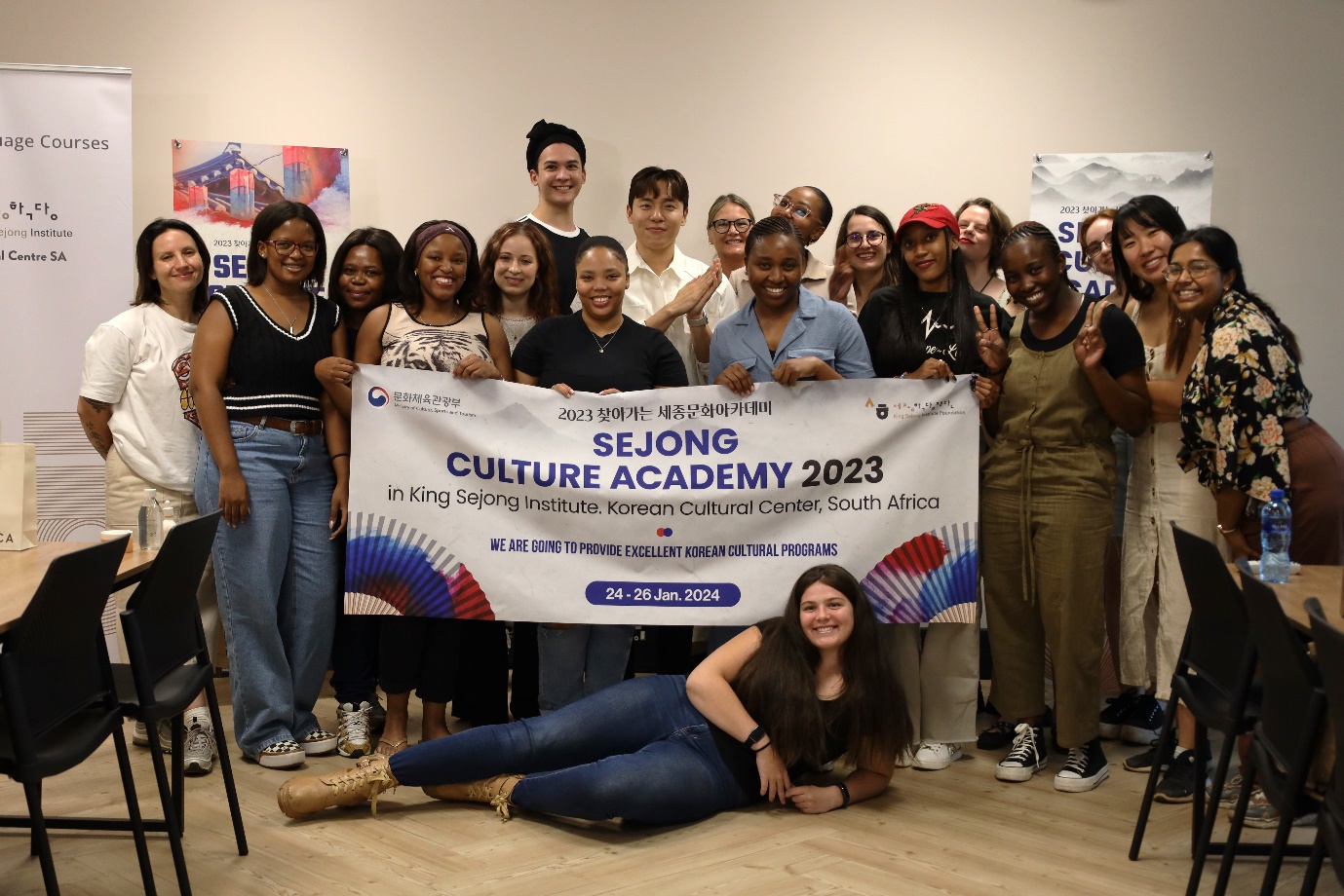 A group of people posing for a photo

Description automatically generated