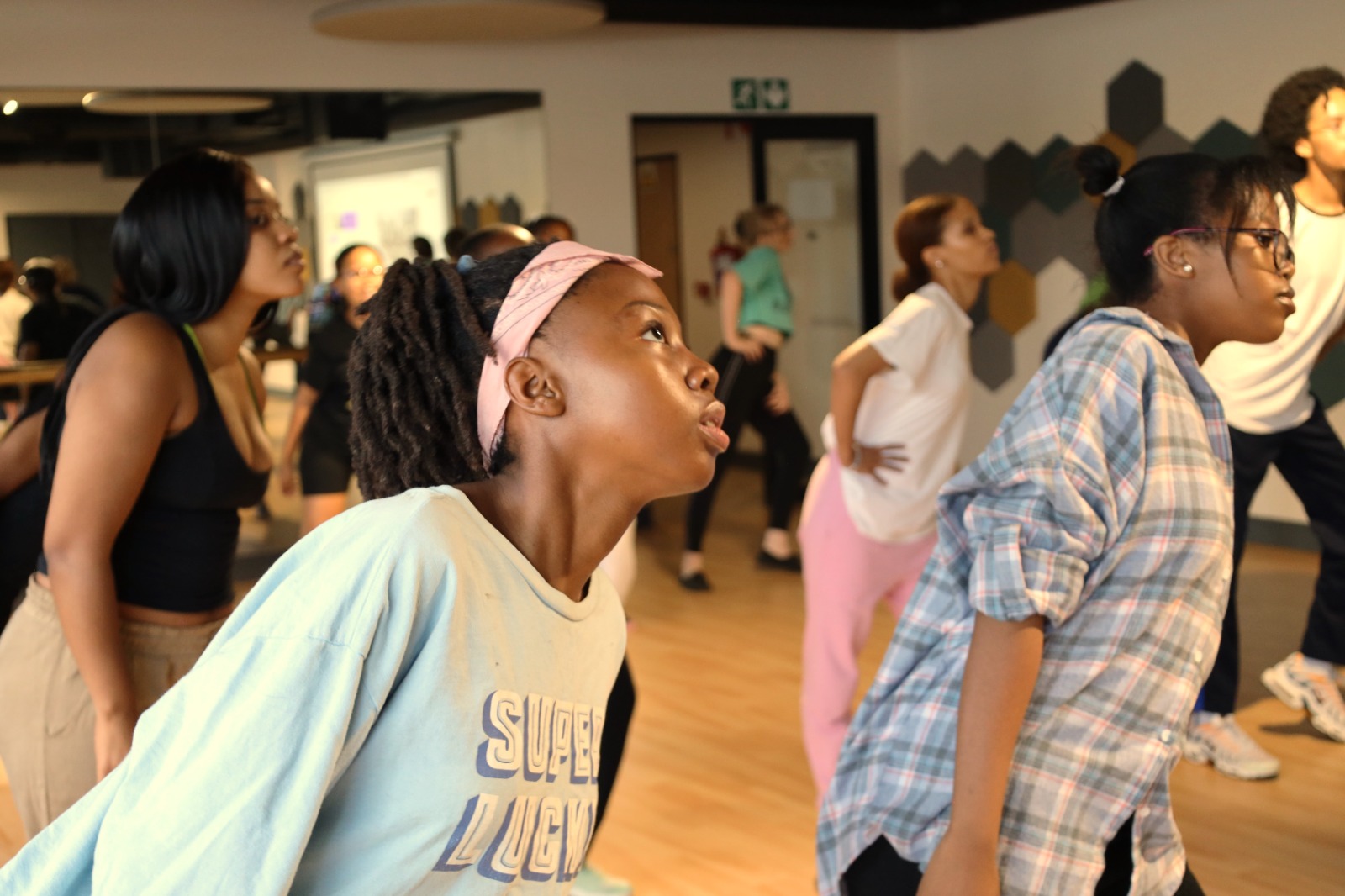 A group of people in a dance class

Description automatically generated