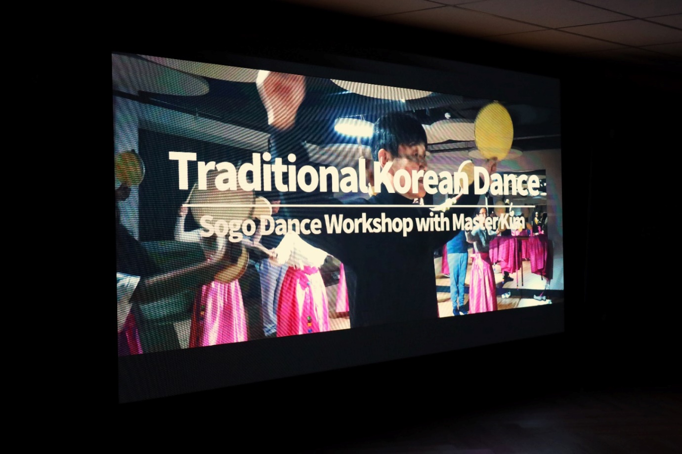 A screen with a group of people dancing

Description automatically generated