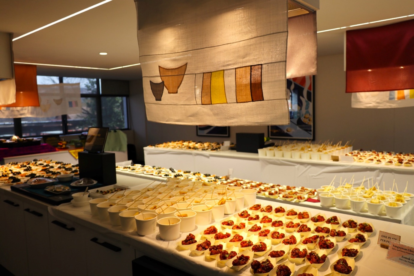 A buffet table with food on it

Description automatically generated