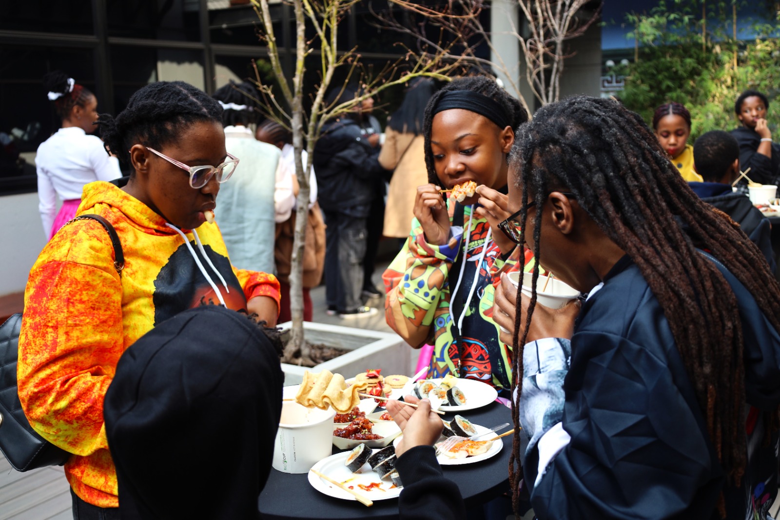 A group of women eating at a table

Description automatically generated