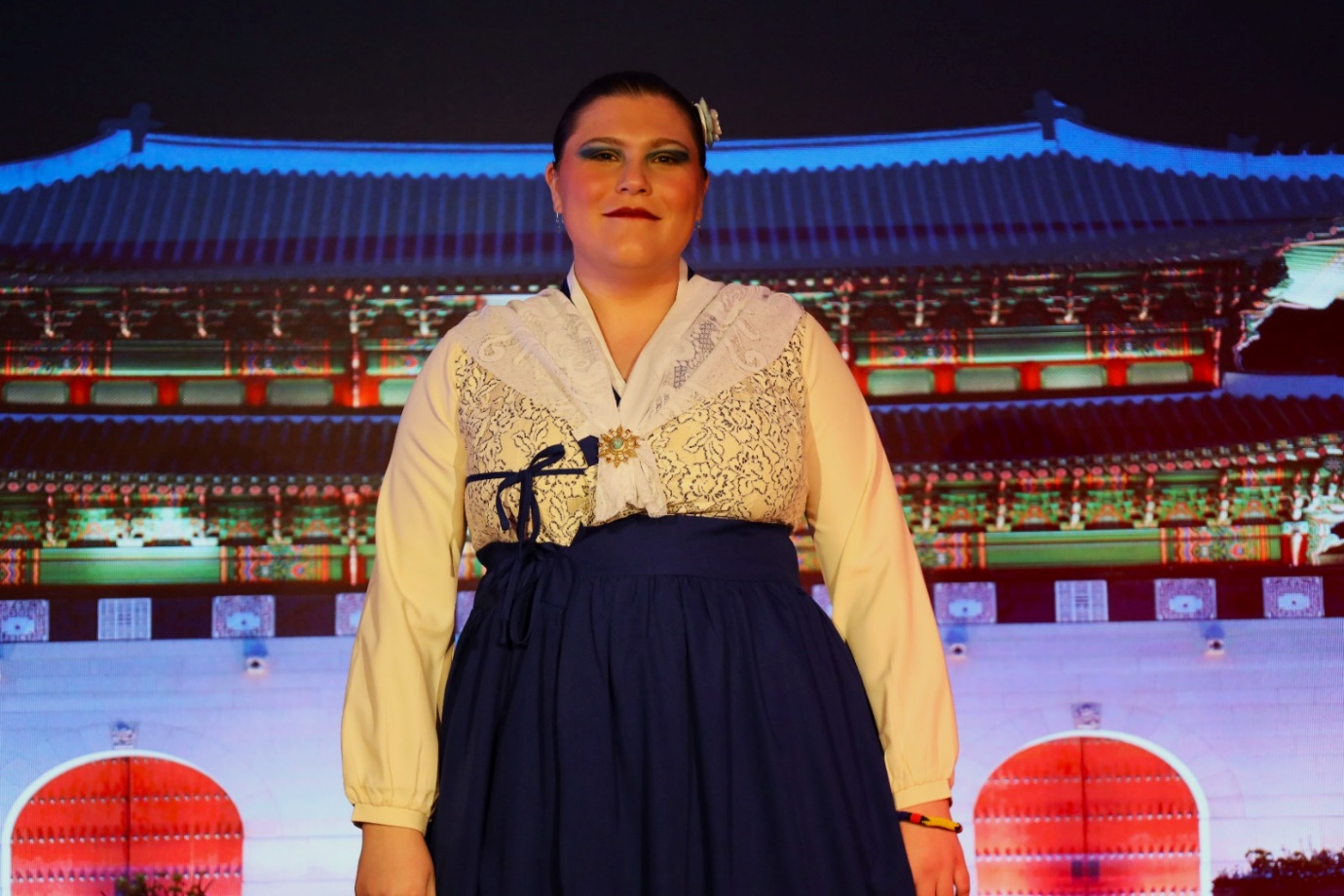 A person in a dress

Description automatically generated