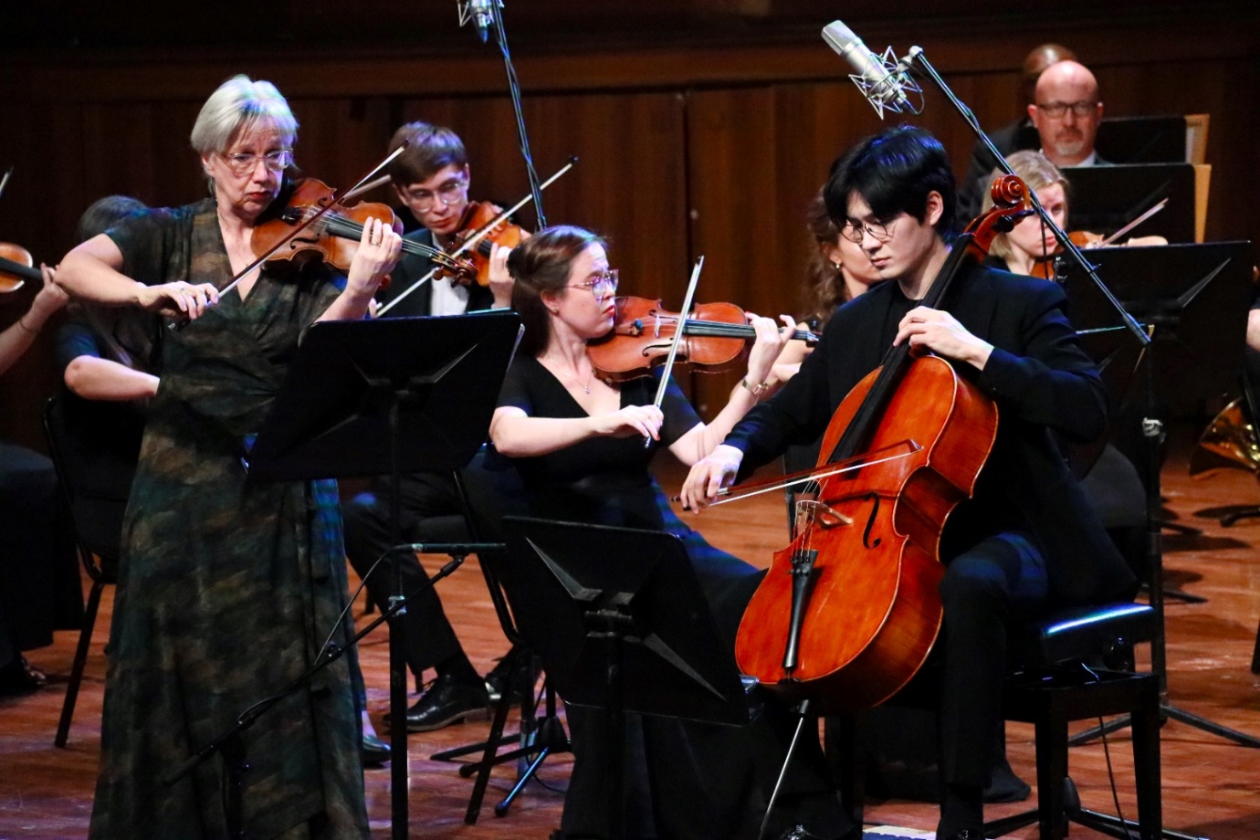 A group of people playing instruments

Description automatically generated