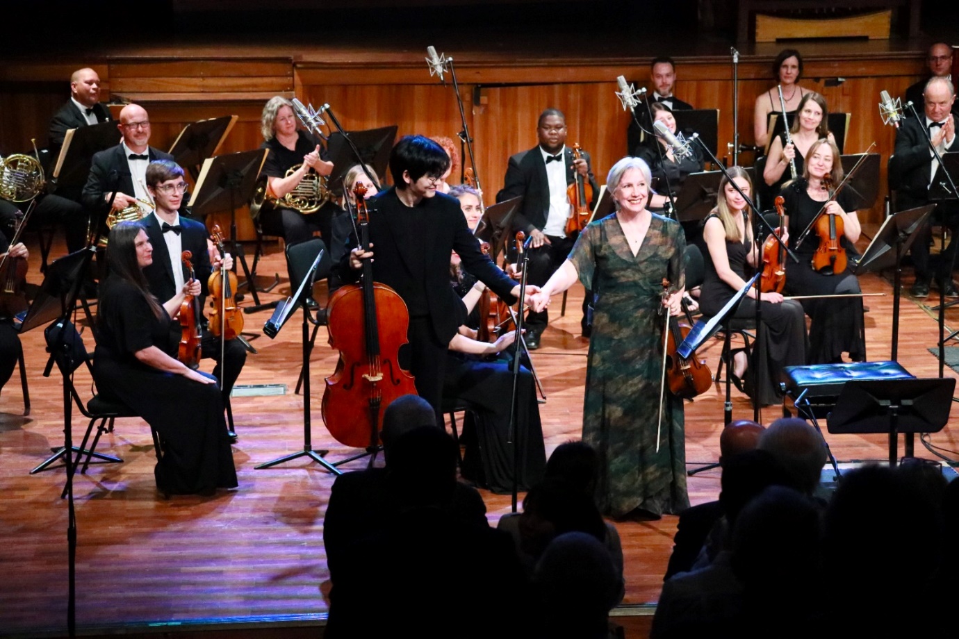 A group of people on a stage

Description automatically generated
