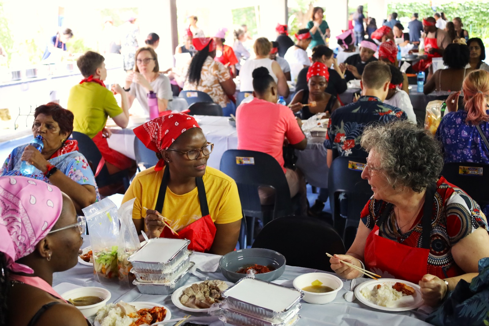 A group of people sitting at a table

Description automatically generated