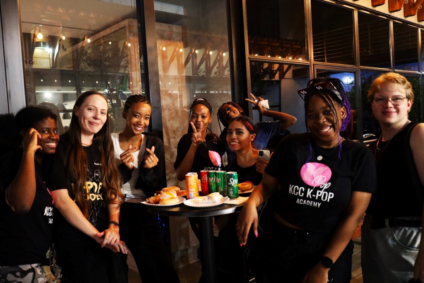 A group of women posing for a photo
Description automatically generated