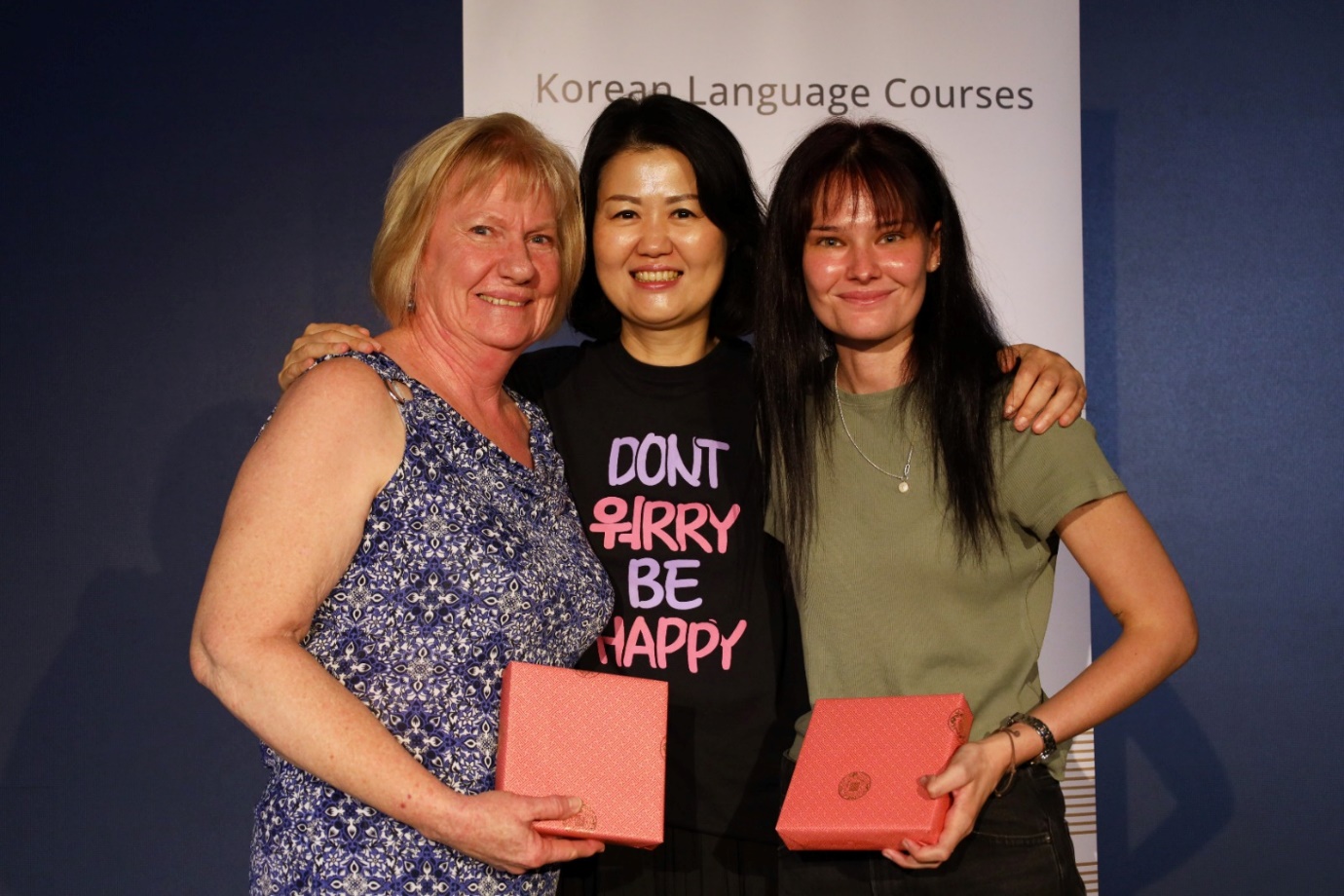 A group of women posing for a photo

Description automatically generated
