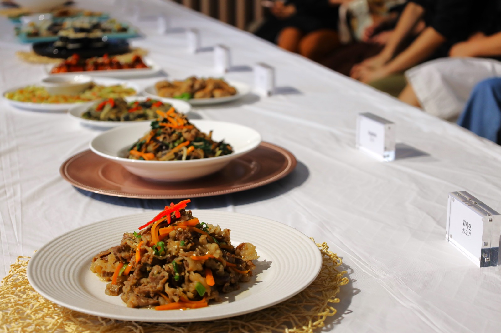 A table with plates of food on it

Description automatically generated