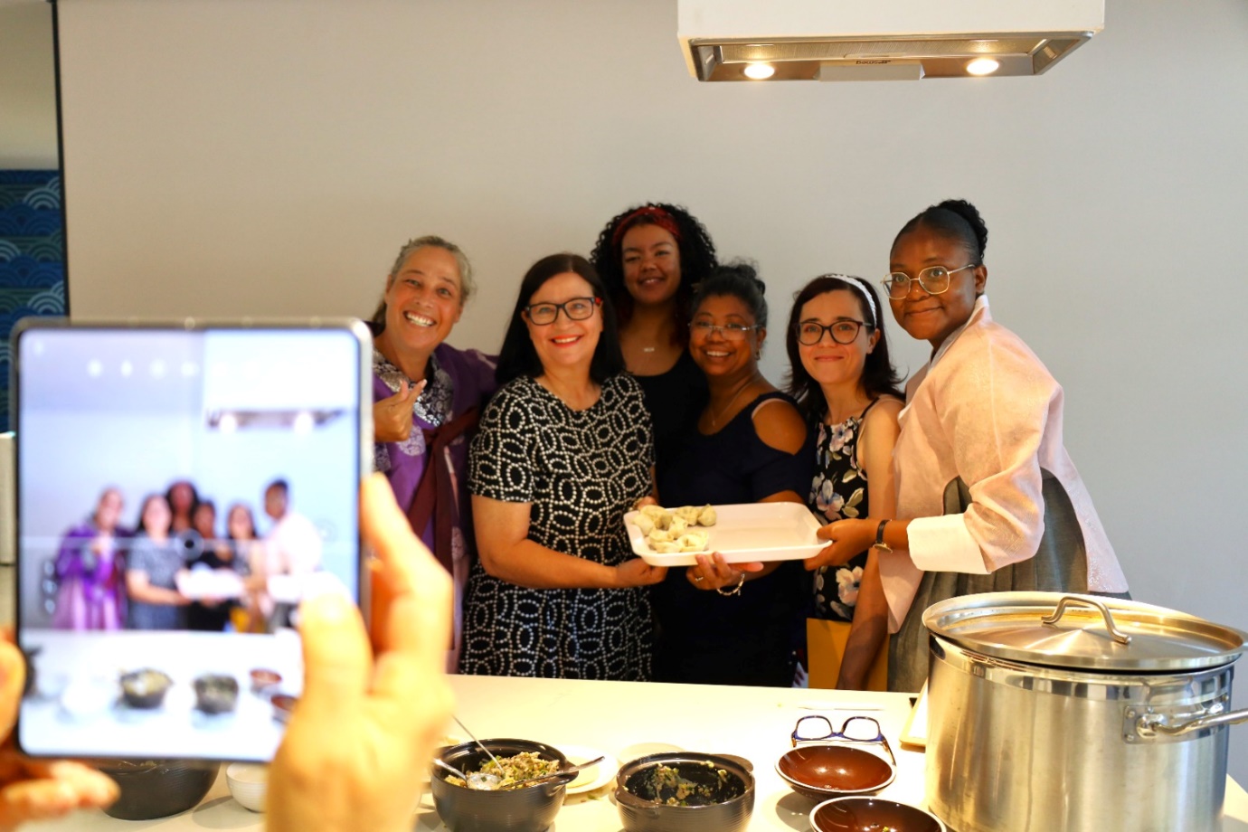 A group of women posing for a photo

AI-generated content may be incorrect.