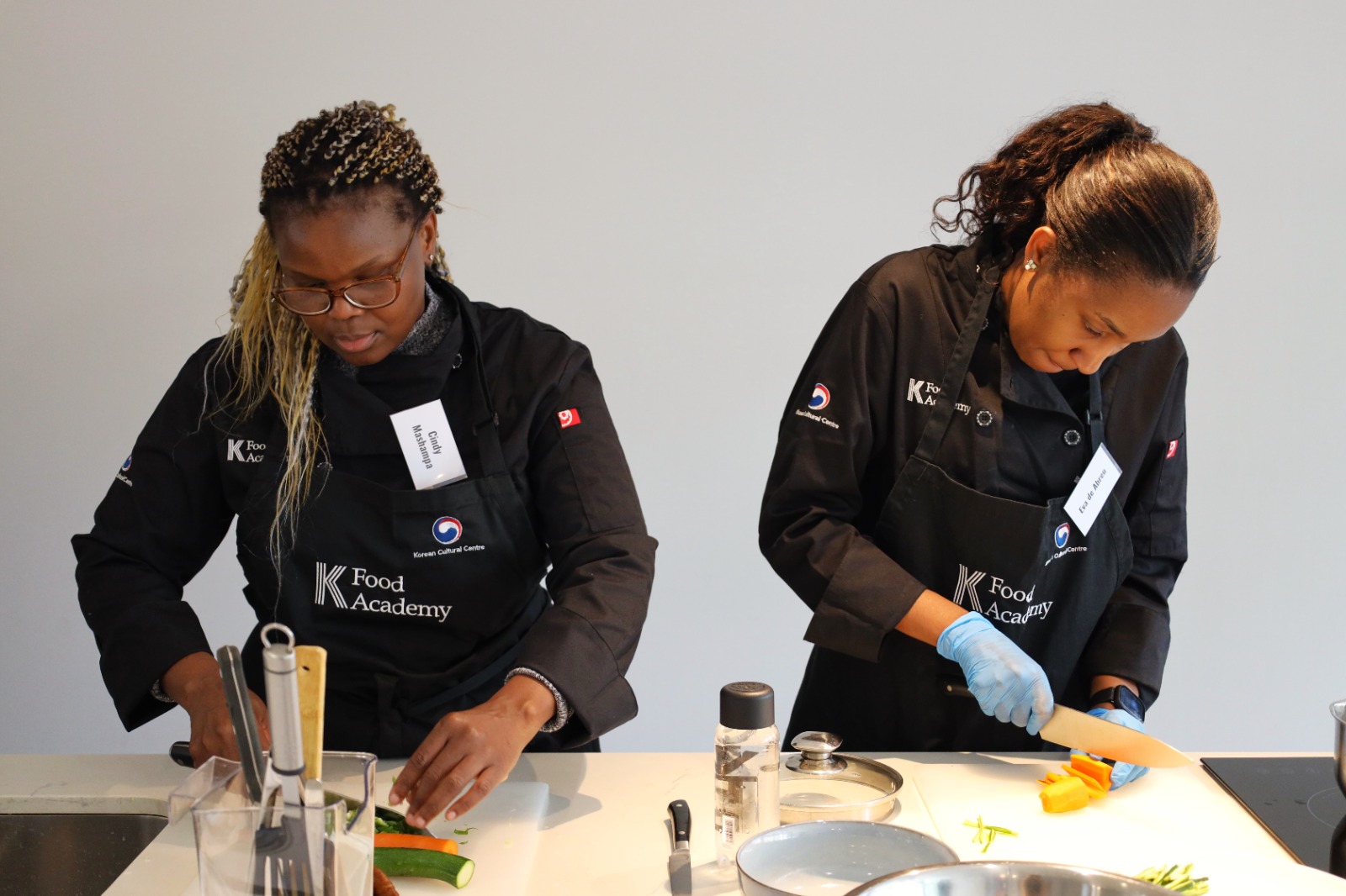 A few women preparing food

AI-generated content may be incorrect.
