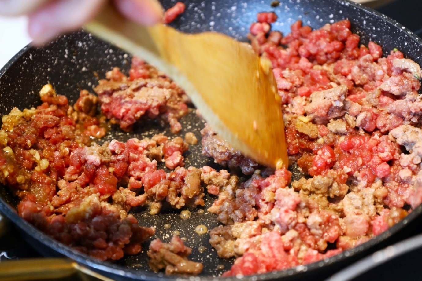 A person stirring food in a pan

AI-generated content may be incorrect.