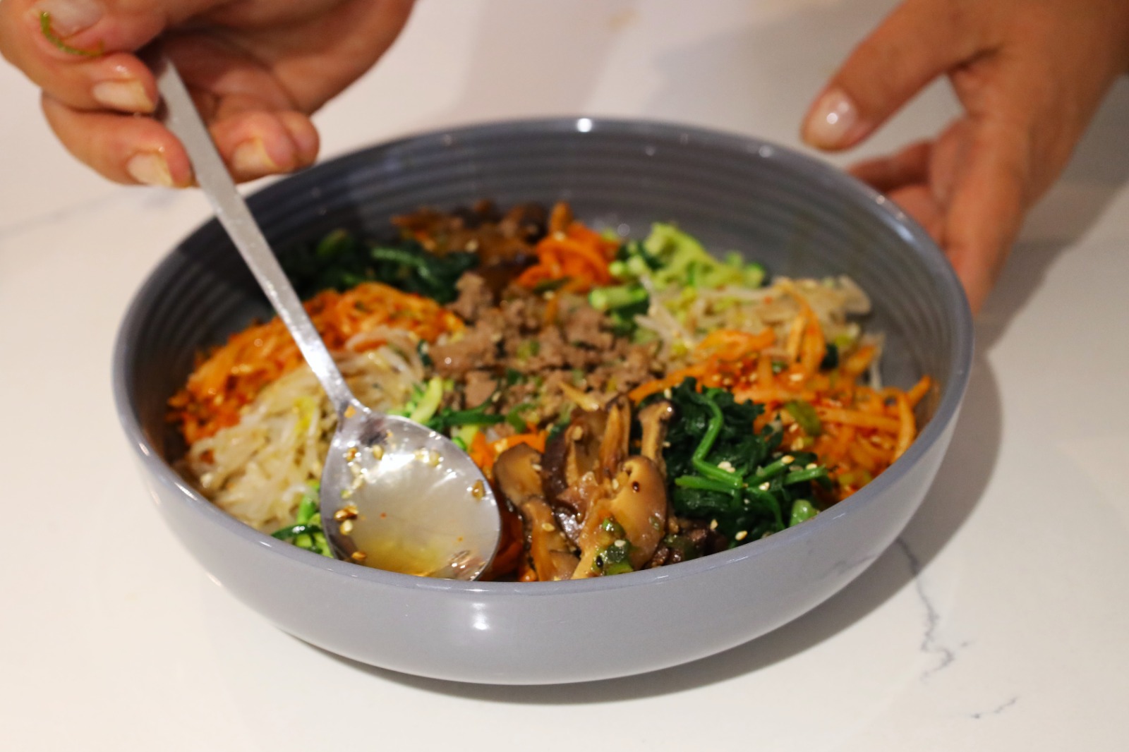 A bowl of food with a spoon

AI-generated content may be incorrect.