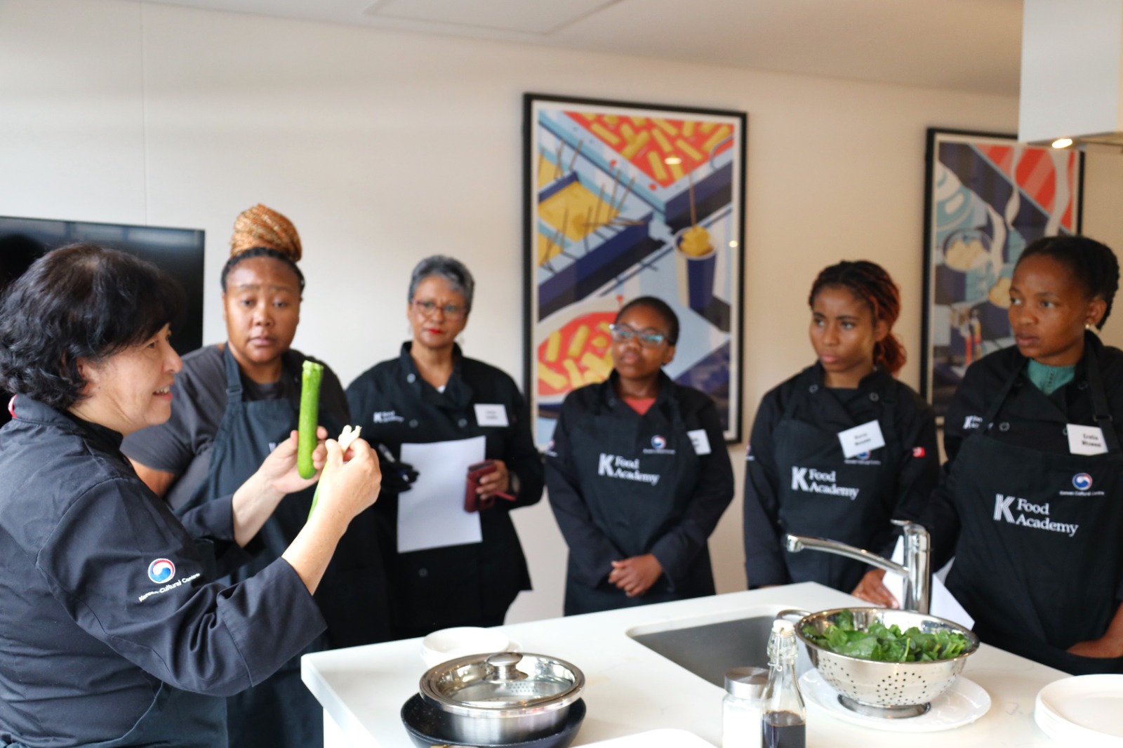 A group of women in a kitchen

AI-generated content may be incorrect.