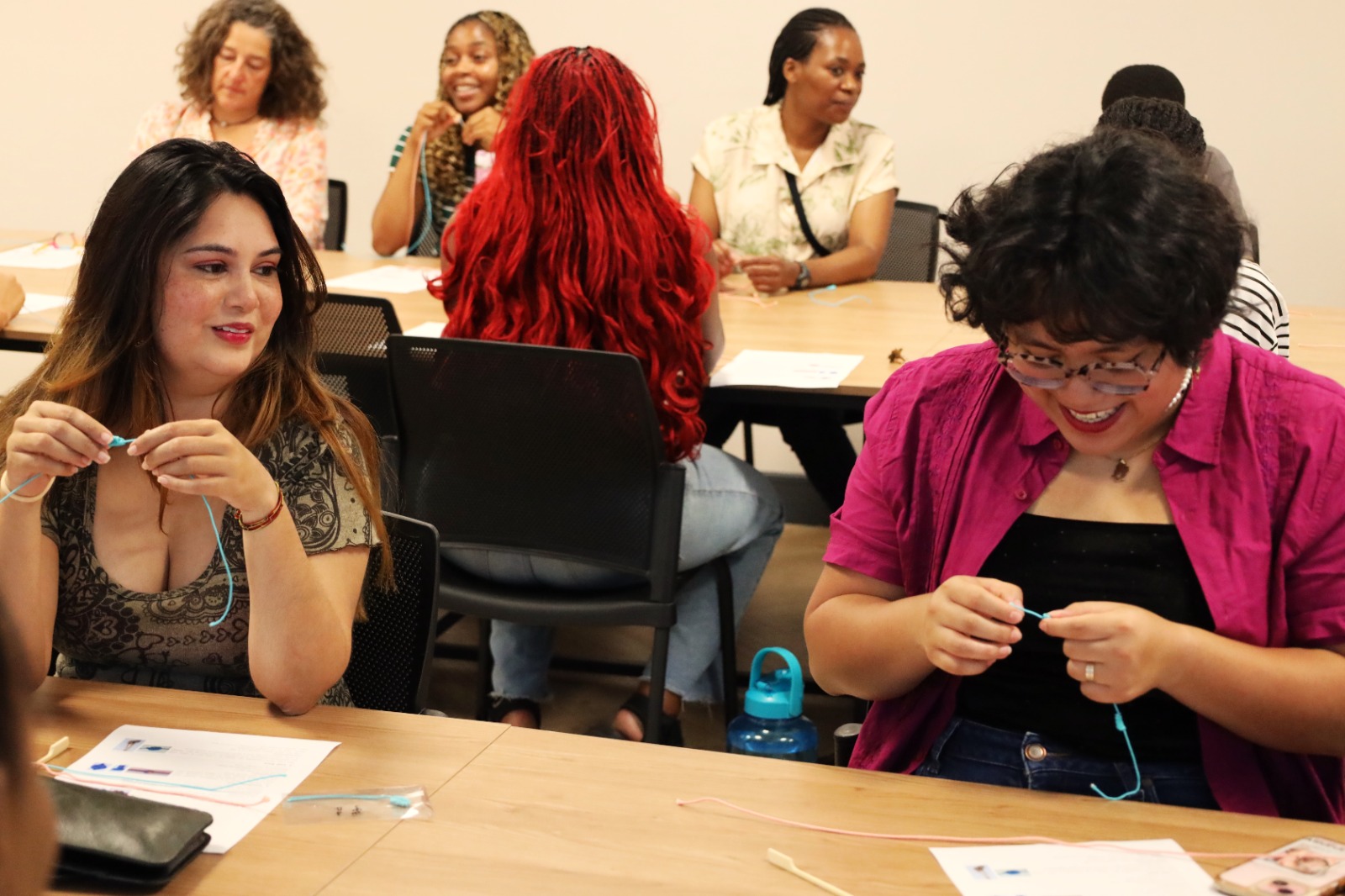 A group of women sitting at tables

AI-generated content may be incorrect.