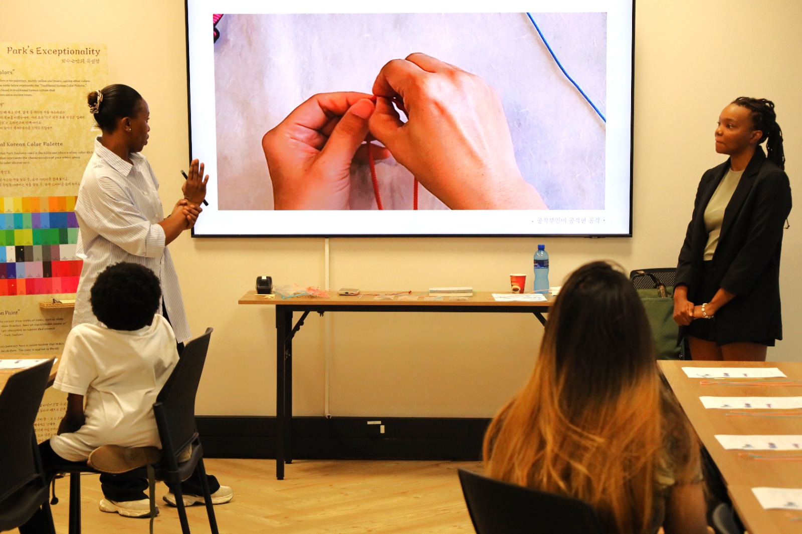 A person giving a presentation to a group of people

AI-generated content may be incorrect.