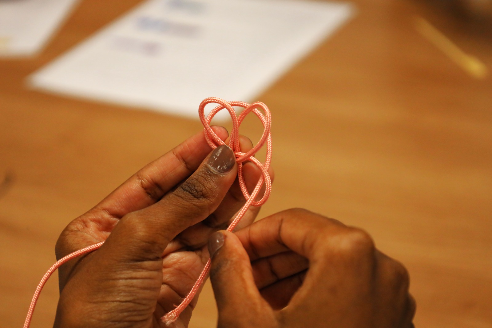 Close-up of hands holding a string

AI-generated content may be incorrect.