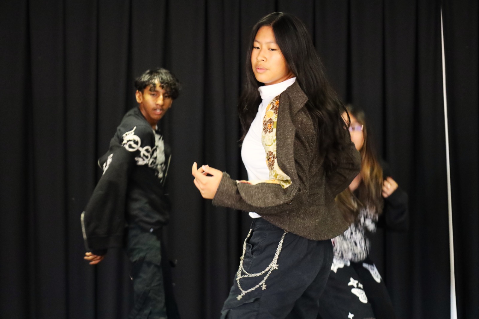 A group of people dancing

AI-generated content may be incorrect.