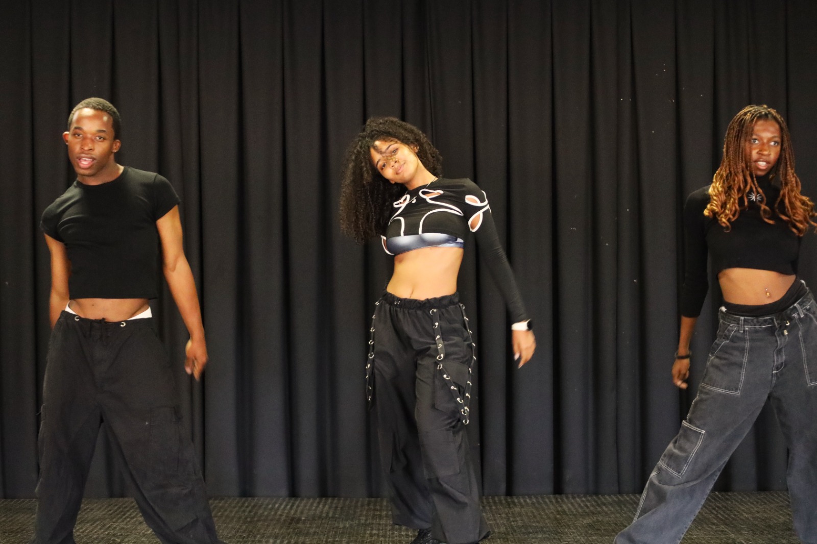 A group of people dancing on stage

AI-generated content may be incorrect.