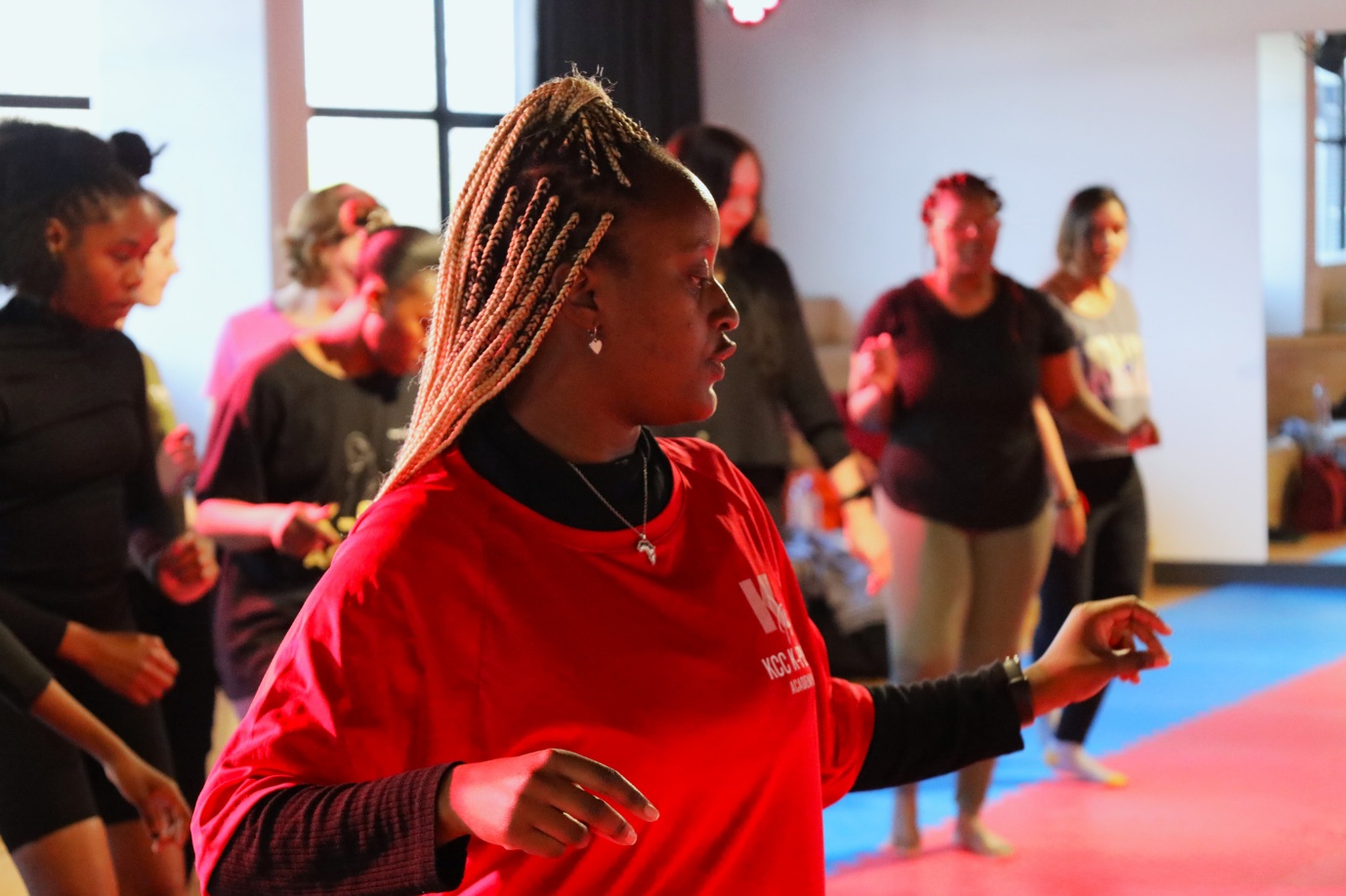 A group of people dancing

AI-generated content may be incorrect.