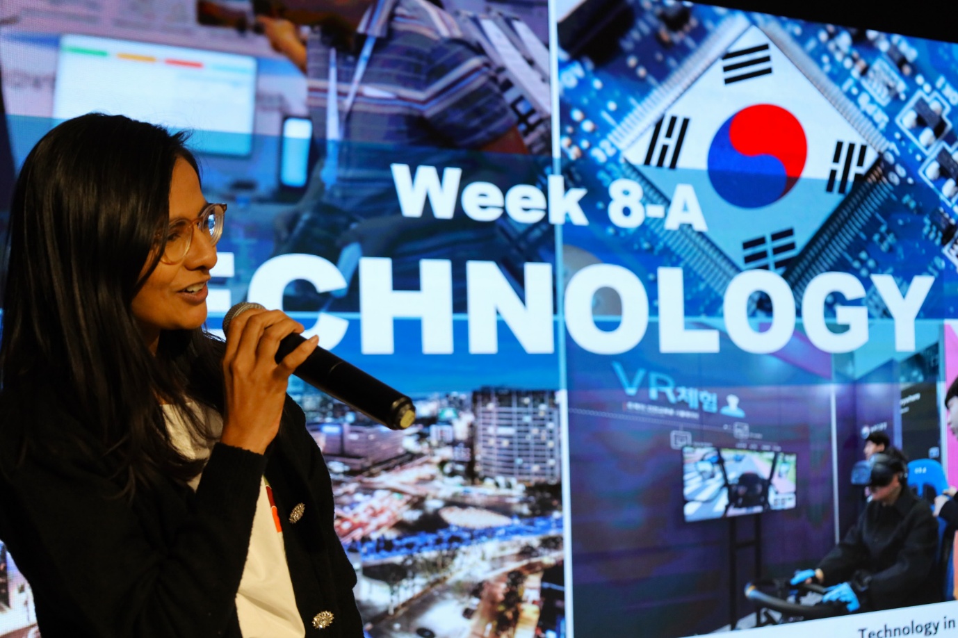 A person speaking into a microphone

AI-generated content may be incorrect.
