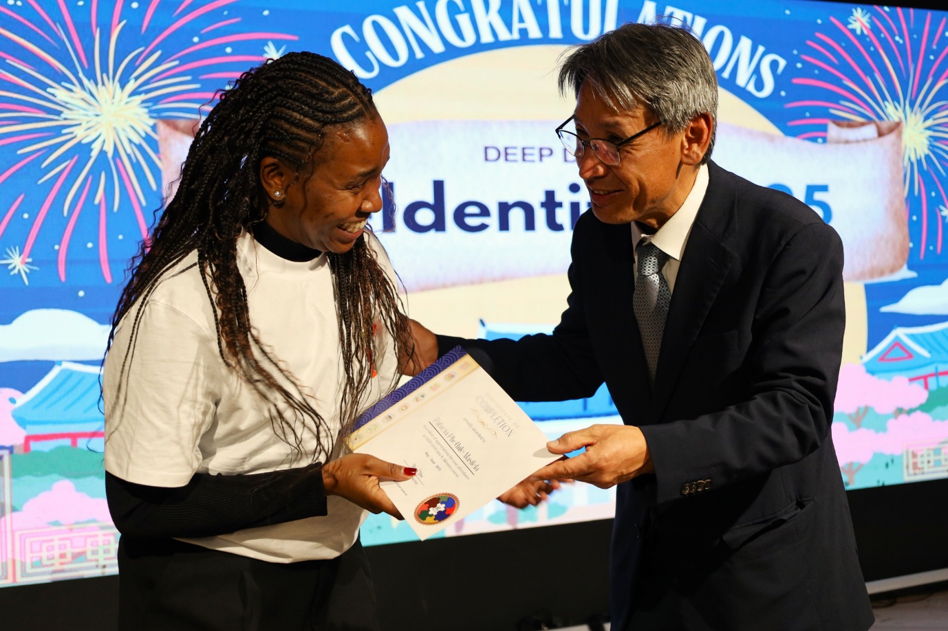 A person and person holding a certificate

AI-generated content may be incorrect.