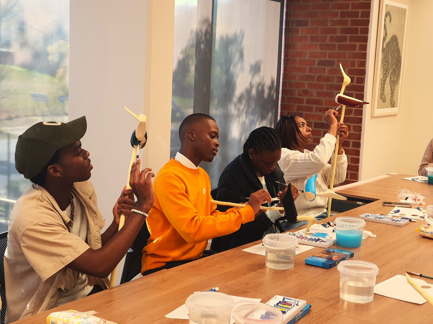 A group of people holding objects

AI-generated content may be incorrect.