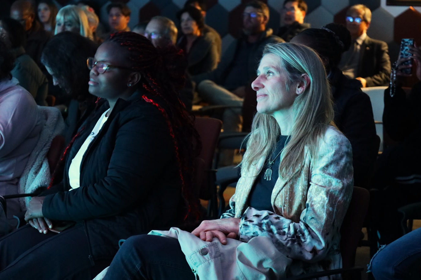 A group of women sitting in chairs

AI-generated content may be incorrect.