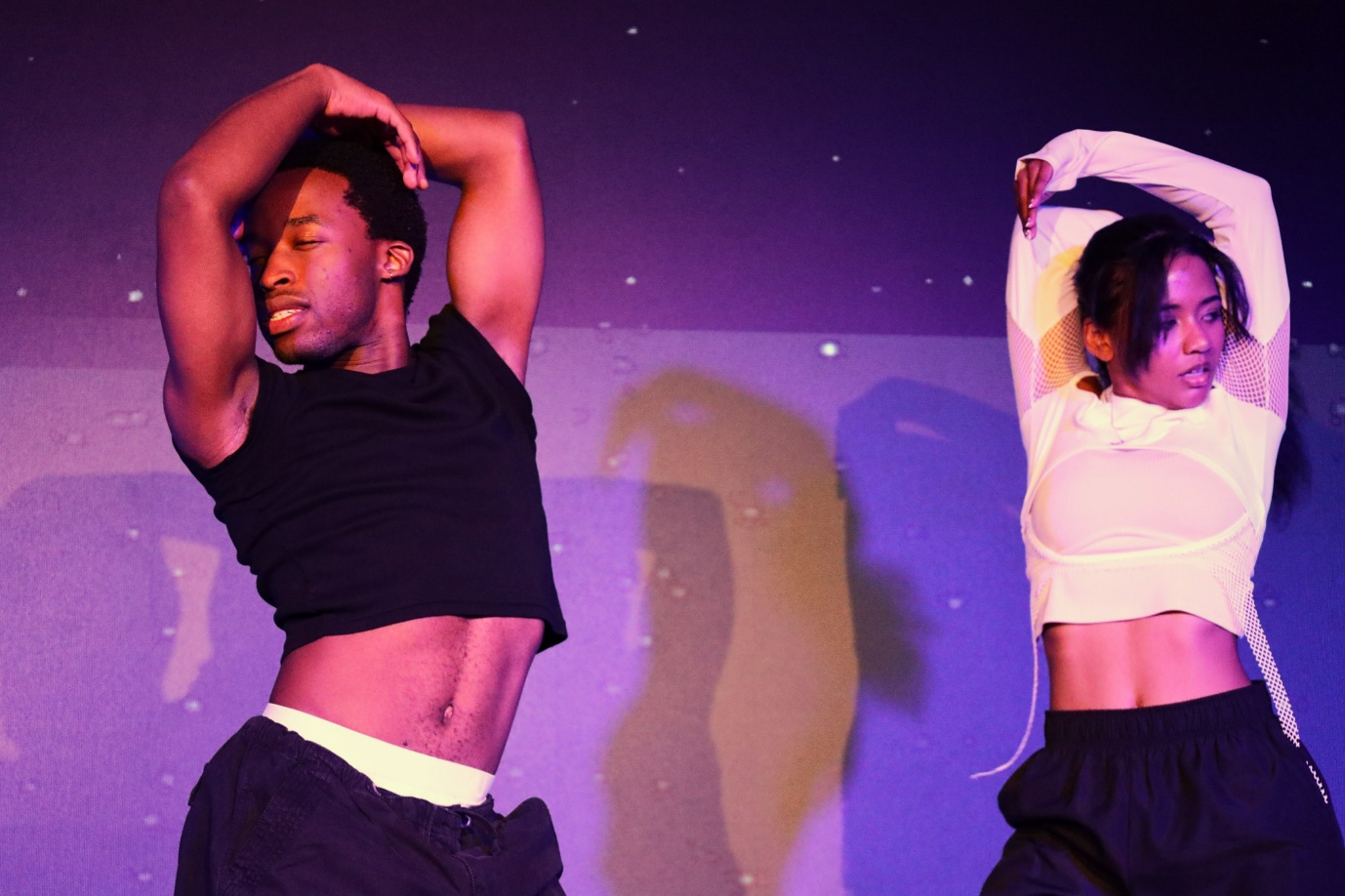 A person and person dancing

AI-generated content may be incorrect.