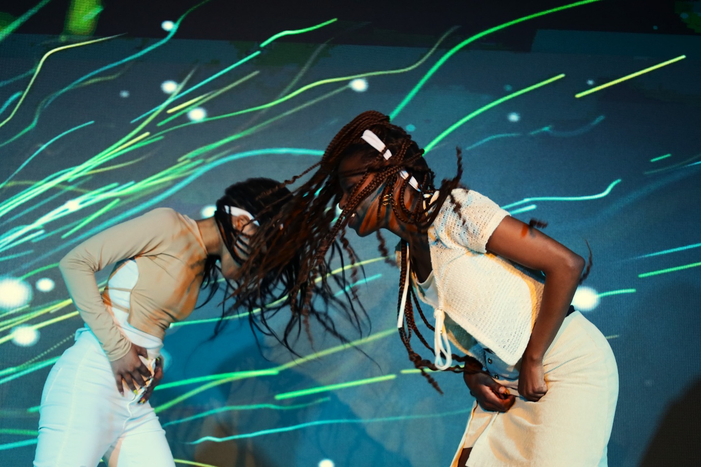 Two women dancing on a stage

AI-generated content may be incorrect.