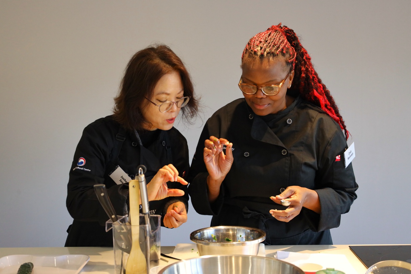 A couple of women in black coats

AI-generated content may be incorrect.