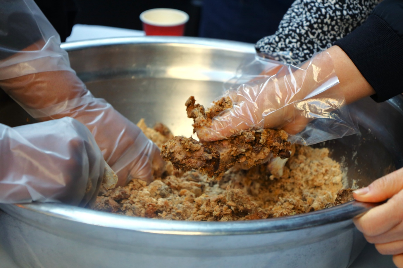 A person holding a piece of food

AI-generated content may be incorrect.