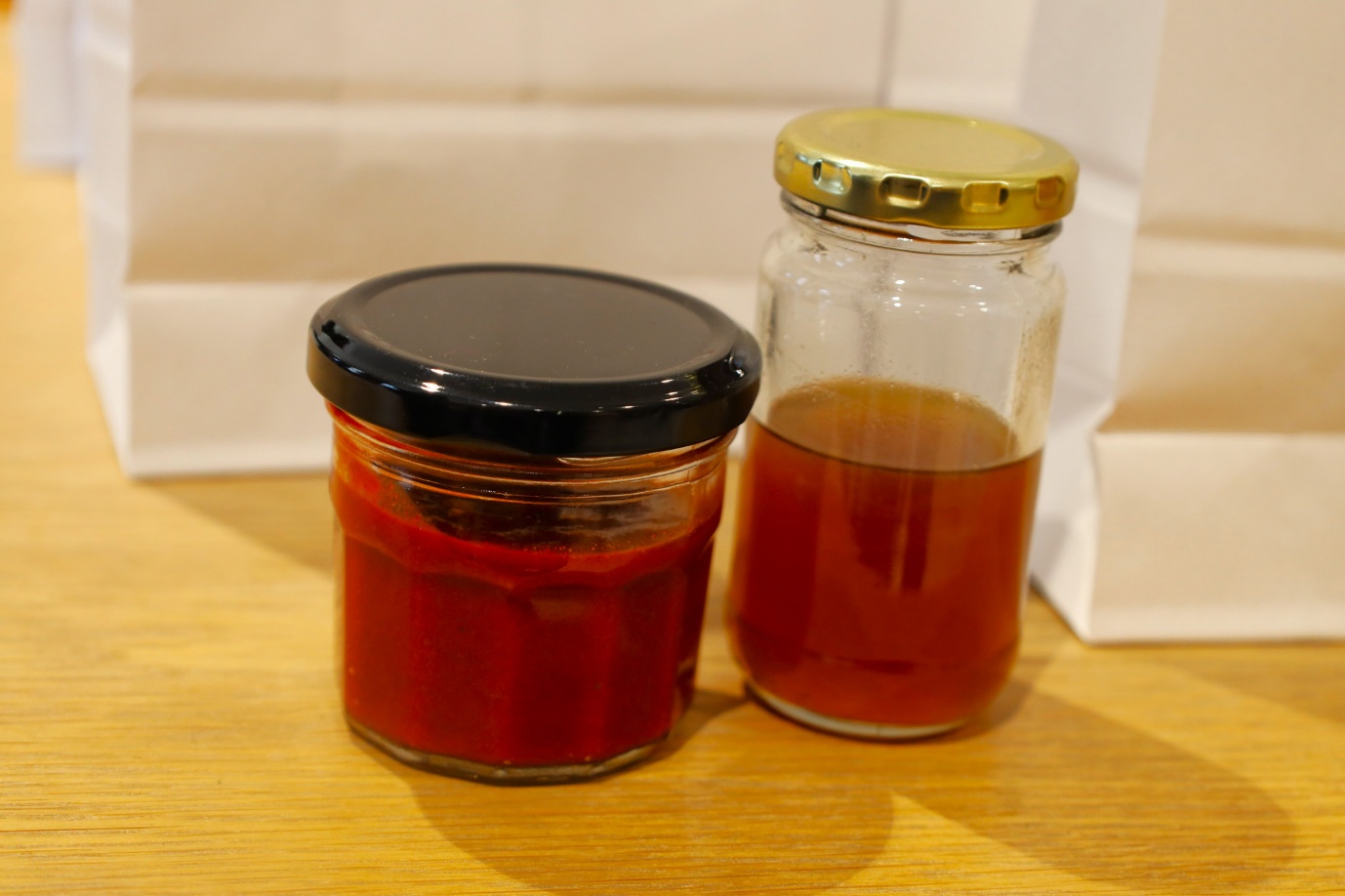 A jar of liquid and a jar of liquid

AI-generated content may be incorrect.