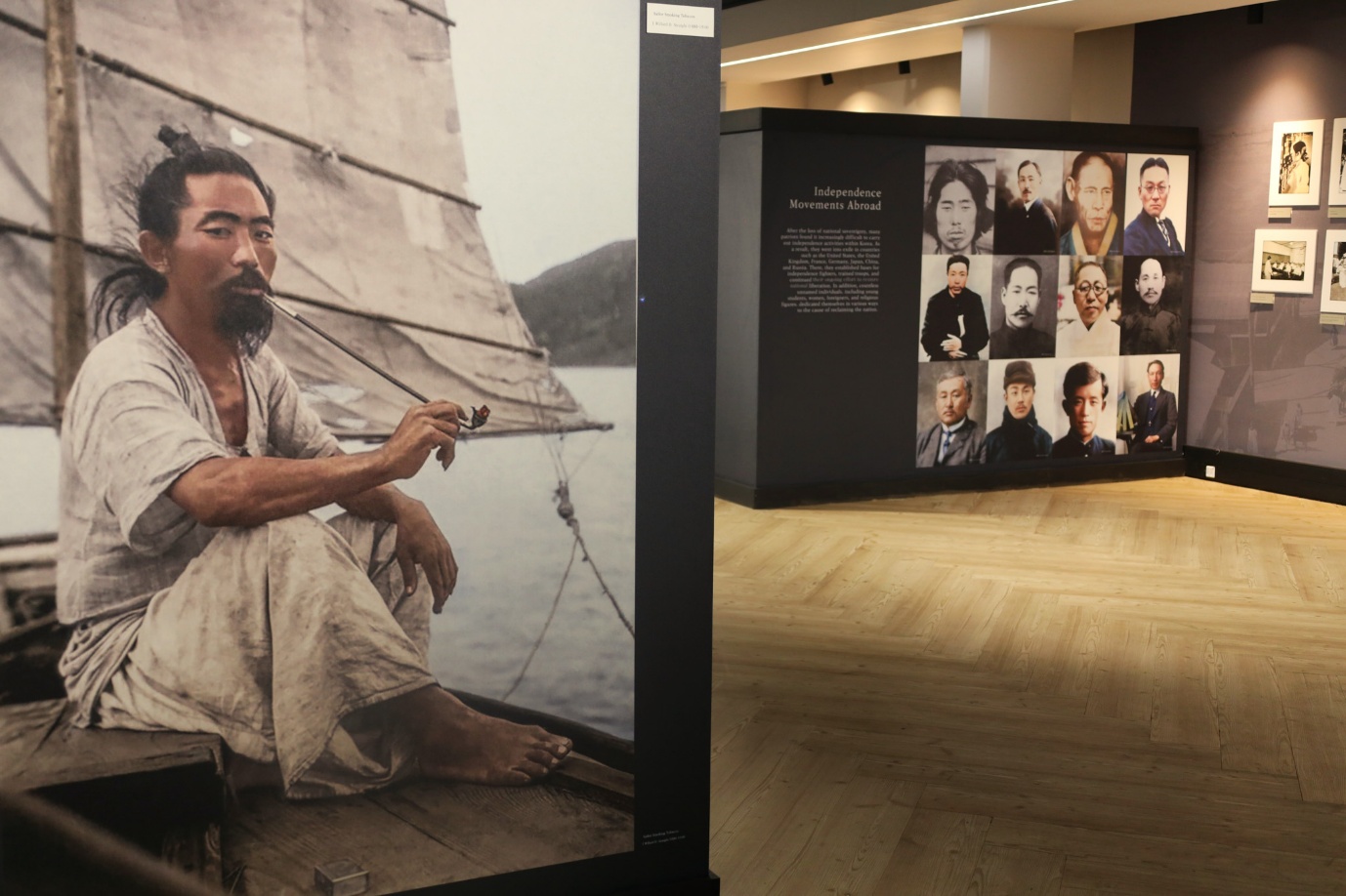 A person sitting on a boat with a picture of a person on the wall

AI-generated content may be incorrect.