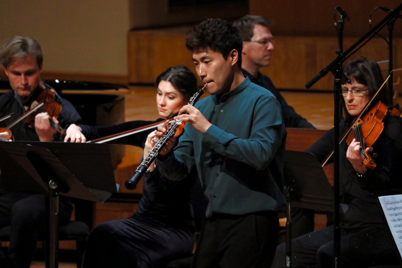 A group of people playing instruments
AI-generated content may be incorrect.