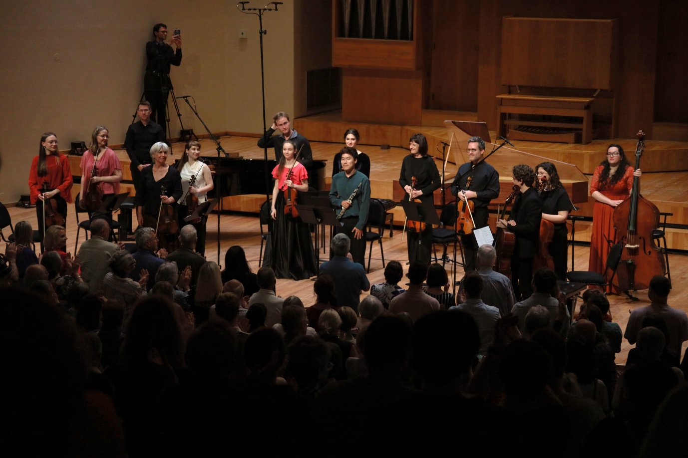 A group of people performing on stage
AI-generated content may be incorrect.