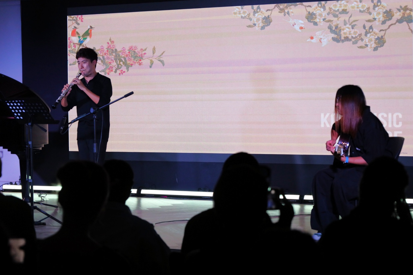 A group of people playing instruments
AI-generated content may be incorrect.