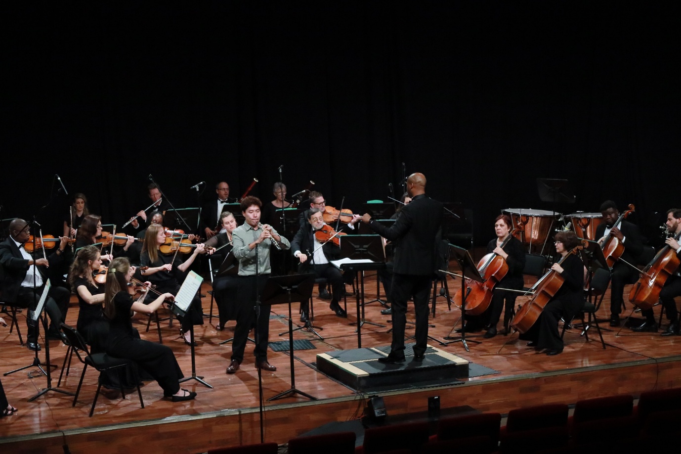 A group of people playing instruments
AI-generated content may be incorrect.