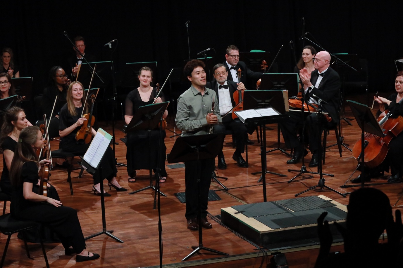 A group of people performing on stage
AI-generated content may be incorrect.